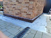 Выполнена отделка цоколя мраморной крошкой